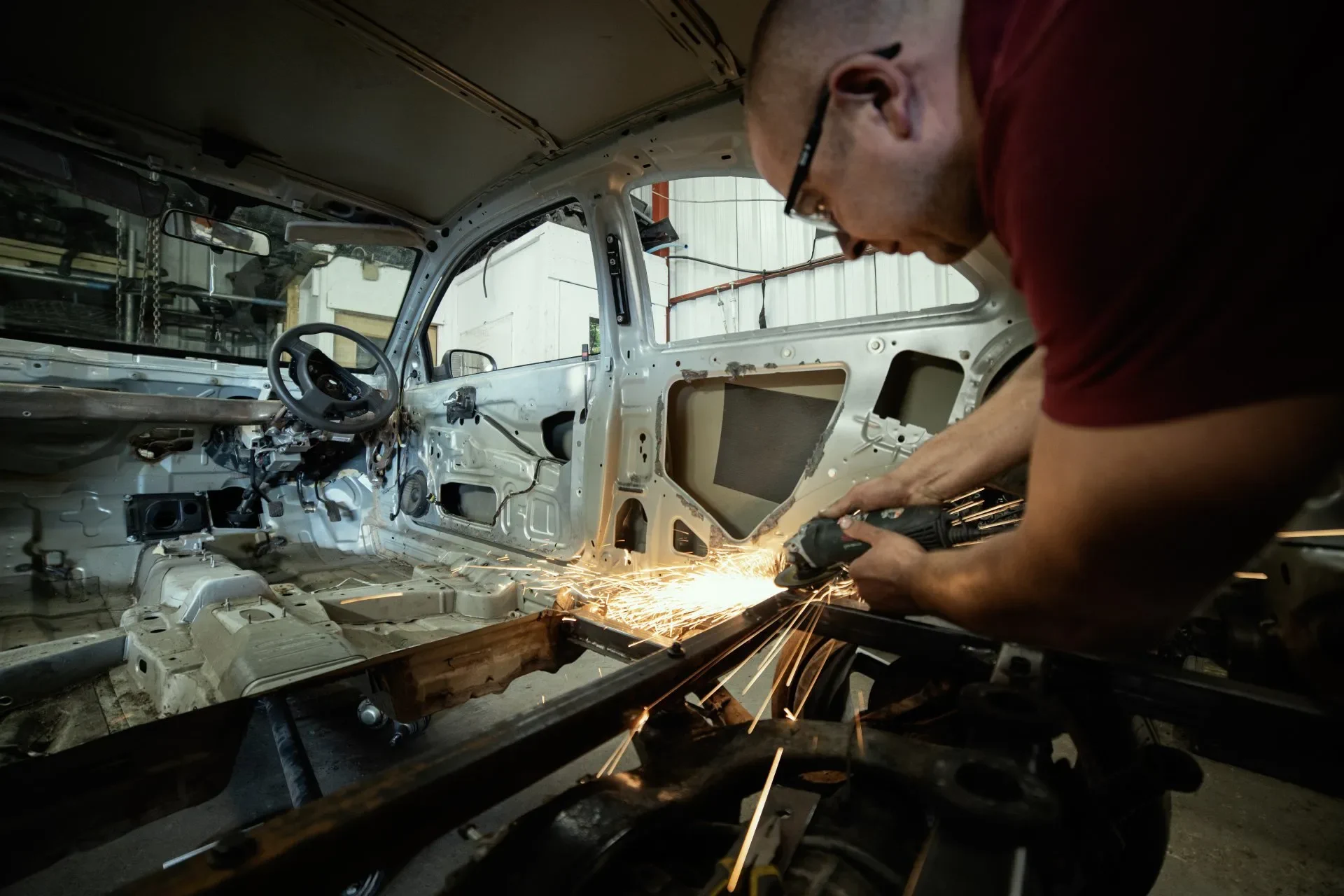 Mechanic working on a vehicle in a professional garage workshop